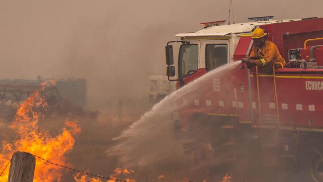 Echuca CFA tankers fight grass fires along Rochester-Strathallan road with the help of waterbombing air support helicopter     A fast moving grass fire impacts a farm, a railway line and destroys a shed and tractor just outside Rochester. Picture: Jason Edwards  Picture: Jason Edwards