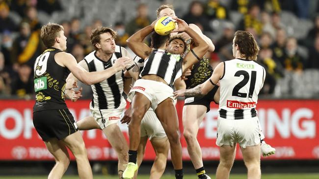 Collingwood’s Issac Quaynor marks in front of Tigers Jack Riewoldt and Tom Lynch. Picture: Darrian Traynor/Getty Images