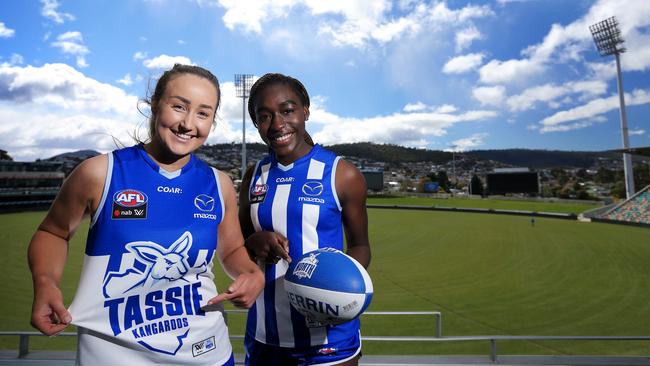 Aspiring Tasmanian AFL players Nicole Bresnehan and Loveth Ochayi are excited about the announcement of the partnership between North Melbourne and the Tasmanian Government for the women's AFLW team. Picture: LUKE BOWDEN