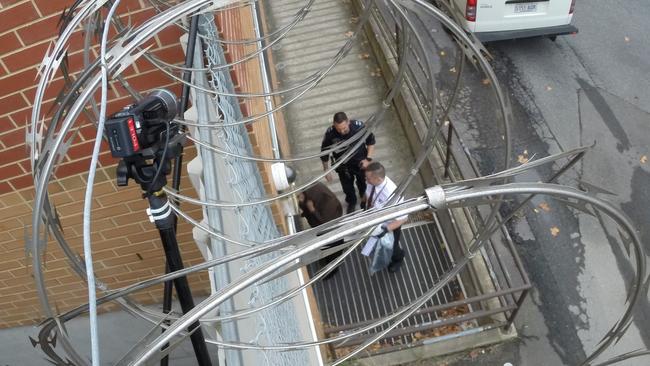 The Adelaide woman enters the Adelaide Magistrates Court on Tuesday. Picture: Greg Higgs.