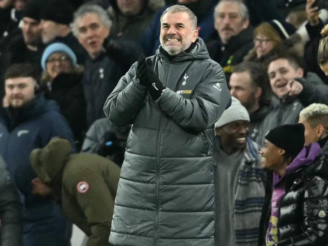 Tottenham Hotspur's Greek-Australian Head Coach Ange Postecoglou celebrates his team's opening goal during the English League Cup semi-final first leg football match between Tottenham Hotspur and Liverpool at the Tottenham Hotspur Stadium in London, on January 8, 2025. (Photo by JUSTIN TALLIS / AFP) / RESTRICTED TO EDITORIAL USE. No use with unauthorized audio, video, data, fixture lists, club/league logos or 'live' services. Online in-match use limited to 120 images. An additional 40 images may be used in extra time. No video emulation. Social media in-match use limited to 120 images. An additional 40 images may be used in extra time. No use in betting publications, games or single club/league/player publications. /