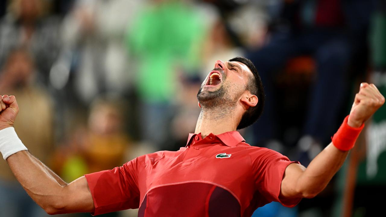 Novak Djokovic roars in the early hours. Photo by Clive Mason/Getty Images.