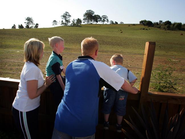 Trevor and Sharee Head with sons Jaidyn and Cooper in their Harrington Park backyard in 2005. Picture: Jeff Darmanin