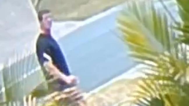 Footage of a stranger entering a yard on the Gold Coast, caught on the security camera of a Pacific Pines resident who had been robbed.