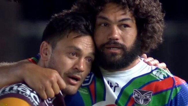 Broncos skipper Alex Glenn gets a hug from Warriors prop Adam Blair after the match.