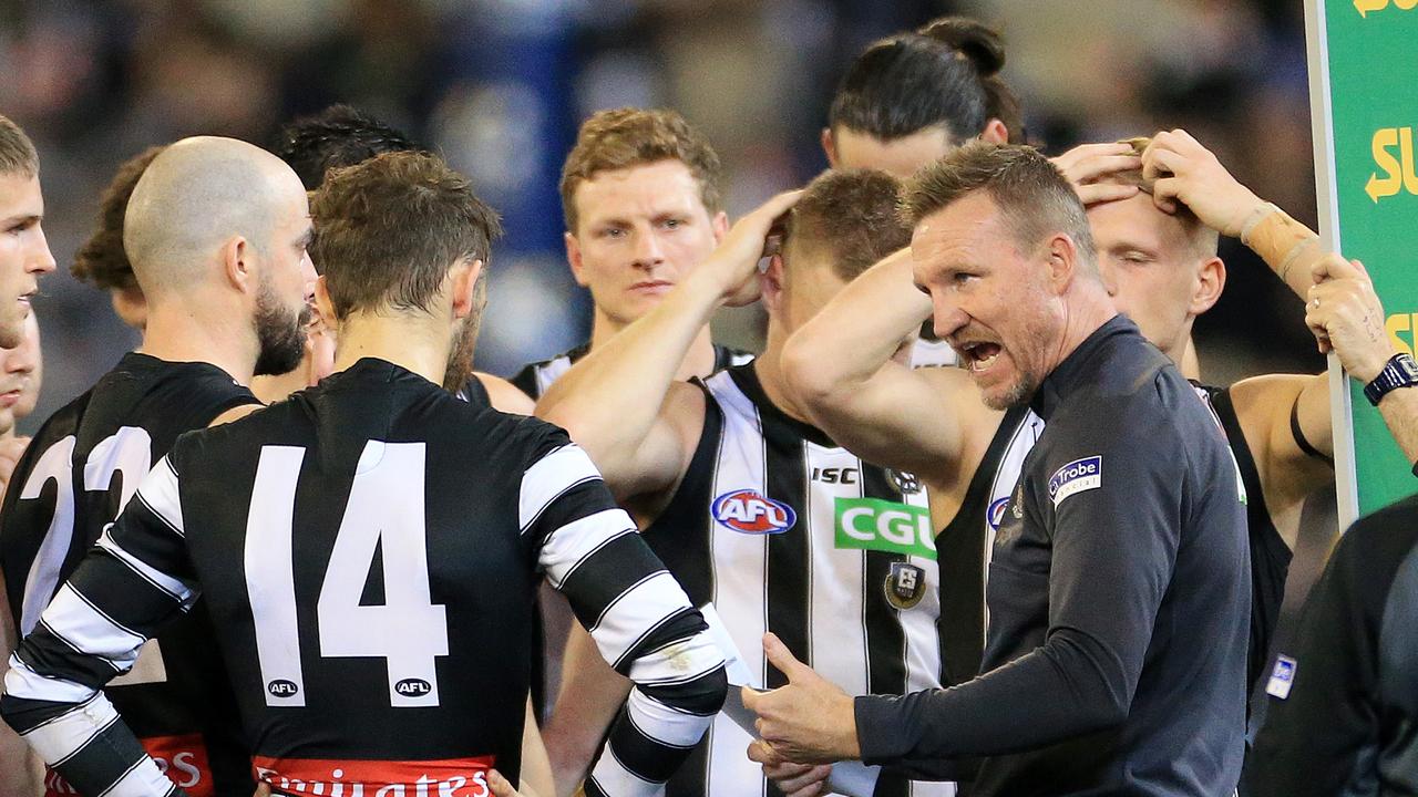 Nathan Buckley talks to his players at a break on Friday night.