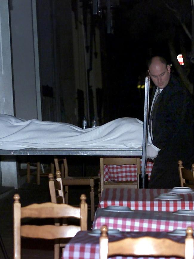 Veniamin’s body being taken away from the La Porcella restaurant in March 2004. Picture: Fiona Hamilton