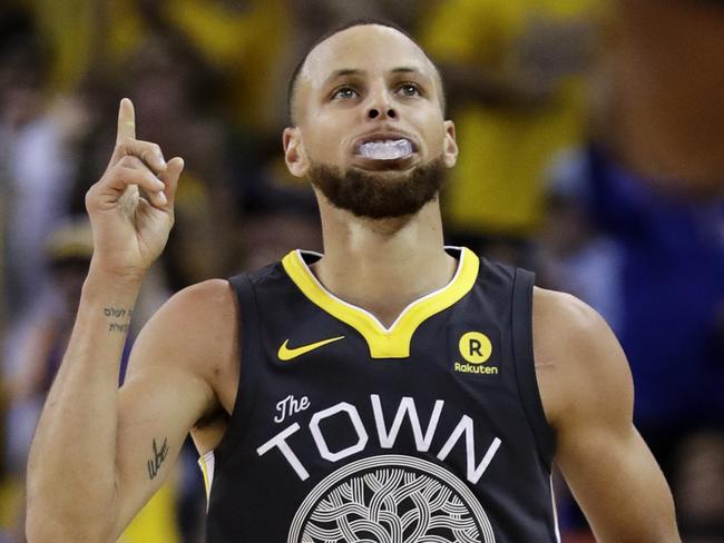 Golden State Warriors guard Stephen Curry (30) gestures after scoring against the Cleveland Cavaliers during the first half of Game 2 of basketball's NBA Finals in Oakland, Calif., Sunday, June 3, 2018. (AP Photo/Marcio Jose Sanchez)