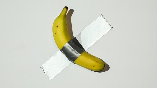 An artwork composed of a fresh banana duct-taped to a wall was bought by Chinese-born crypto founder Justin Sun for $6.2m – and then eaten. Picture: AFP