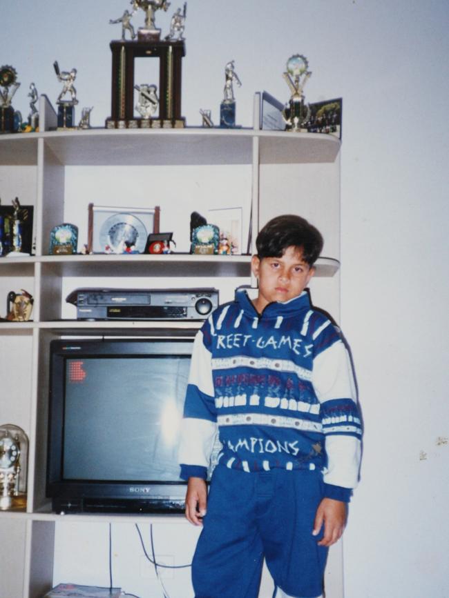 Khawaja stands in front of a monster trophy haul in 1996.