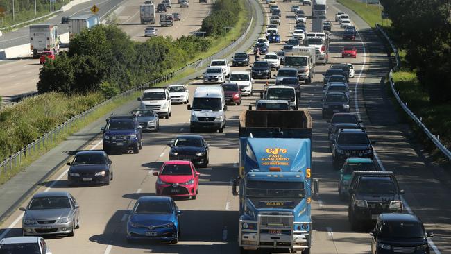 Speed Limit 100km/h. They’re lucky to get to 60km/h. The M1 southbound at Coomera at 8am today. Picture Glenn Hampson.