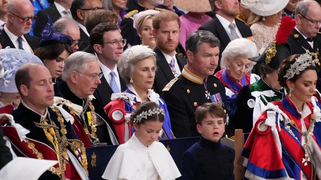 Prince Harry sits in the third row and looks across to his brother, in the front row. Picture: Victoria Jones - WPA Pool/Getty Images