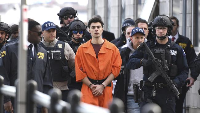 Luigi Mangione, a suspect in the fatal shooting of UnitedHealthcare CEO Brian Thompson, is escorted by police in New York. Picture: AP