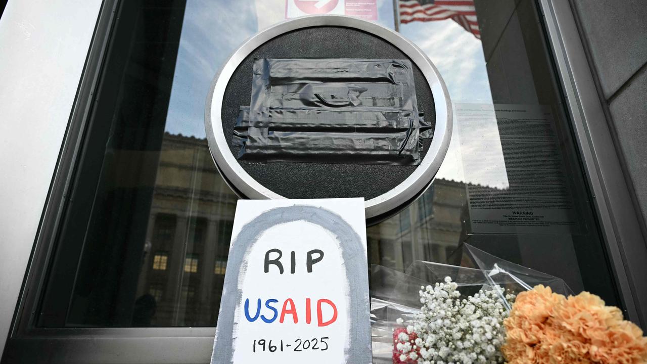 Tributes beneath the covered seal of the US Agency for International Development headquarters in Washington, DC. Picture: Mandel Ngan/AFP