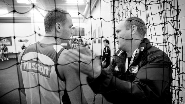 Coach Rodney Eade talks with Adam Cooney.