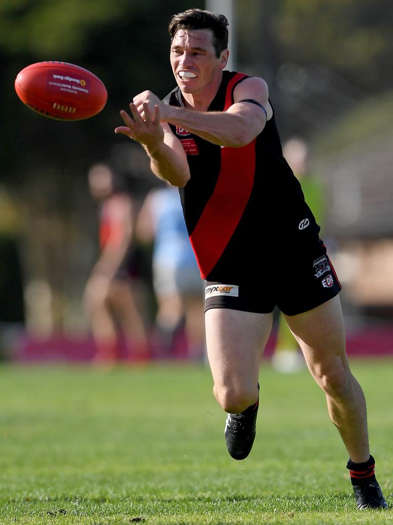 Essendon District: Liam Ogden fires off a handball for Pascoe Vale against Aberfeldie. Picture: Andy Brownbill