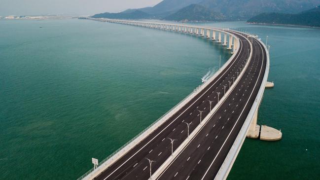 TOPSHOT - An aerial view taken on October 22, 2018, shows a section of the Hong Kong-Zhuhai-Macau Bridge (HKZM) in Hong Kong. - The world's longest sea-bridge connecting Hong Kong, Macau and mainland China will be launched October 23, at a time when Beijing seeks to tighten its grip on its territories. (Photo by Anthony WALLACE / AFP)