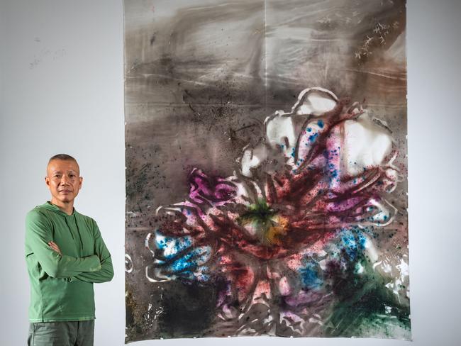 Cai Guo-Qiang with Transiceence II, a new 31-meter gunpowder painting he created in Melbourne for the NGV exhibition. Picture: Jason Edwards