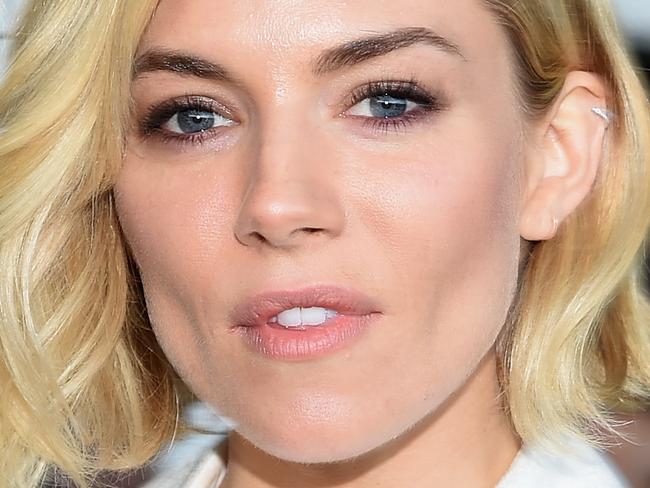 NEW YORK, NY - FEBRUARY 19: Actress Sienna Miller attends the Calvin Klein Collection fashion show during Mercedes-Benz Fashion Week Fall 2015 at Spring Studios on February 19, 2015 in New York City. (Photo by Mike Coppola/Getty Images for Mercedes-Benz Fashion Week)