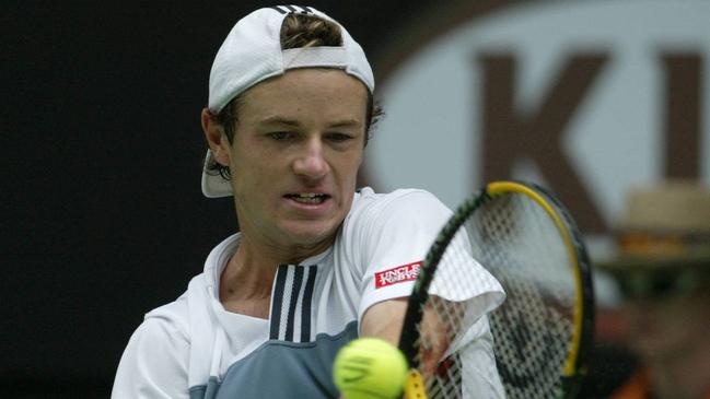 Todd Reid in action against Roger Federer at the Rod Laver Arena in 2004