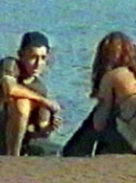 Skaf speaking with a young woman on Bondi Beach in October 2000.