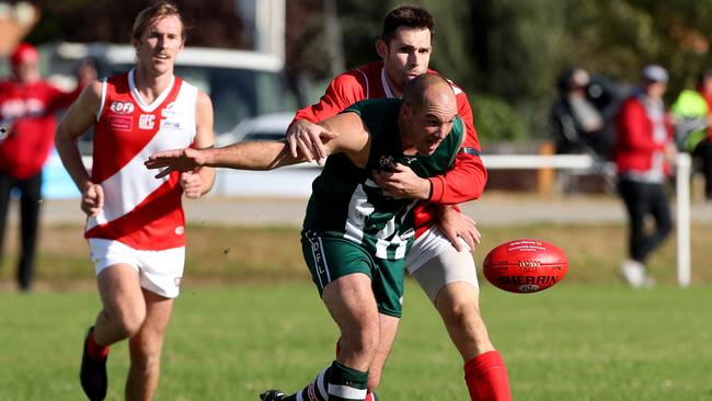 Airport West star Clayton Rogers leads the race to the footy. Picture: Mark Dadswell