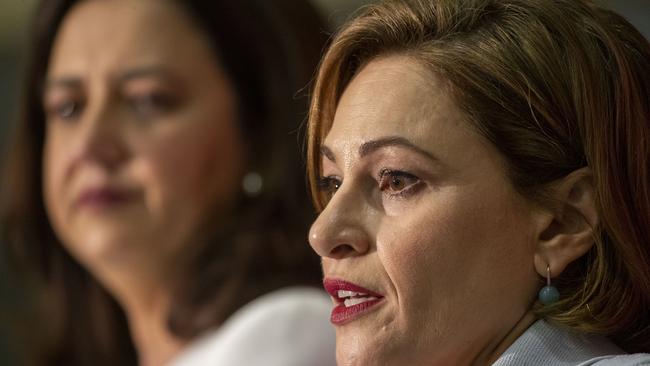 Queensland Premier Annastacia Palaszczuk and Treasurer Jackie Trad (right) speak during the state government's 2019-20 Queensland budget media briefing in Brisbane, Tuesday, June 11, 2019. (AAP Image/Glenn Hunt) NO ARCHIVING