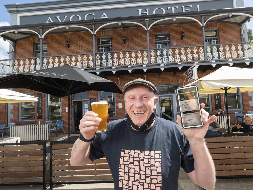 Publican Ian Urquhart shows his double vaccination status at the Avoca Hotel, which is part of the state government's "vaccine economy" trial. Picture: Rob Leeson.