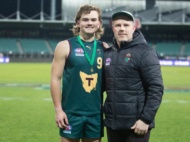 Harry Bayles, pictured with coach Trent Baumeler, won the Lefroy Medal as Tasmania’s best in Saturday’s tight loss to Sydney/Canberra. Picture: Linda Higginson