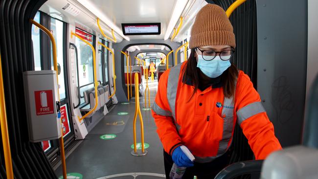 A member of the Sydney light rail cleaning team is seen wearing a face mask at Randwick Station. While face masks have not been made mandatory in New South Wales, state Premier Gladys Berejiklian has urged residents across the NSW to wear face masks when on public transport, in the supermarket, or in enclosed spaces where social distancing is difficult. (Photo by Lisa Maree Williams/Getty Images)