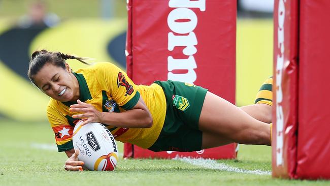 Corban McGregor scores a try for the Jillaroos.