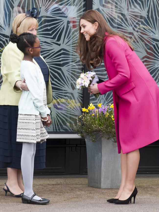 Kate receives a posy of flowers from Stephen Lawrence's niece Mia.