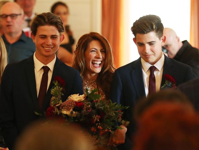 Robin Bailey walked down the aisle by her sons Fin Smart, 18, and Lewin Smart, 16. Picture: Liam Kidston