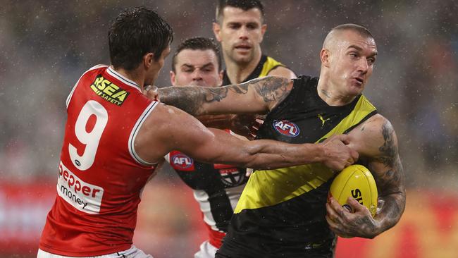 Richmond’s Dustin Martin tries to fend of Jack Steele of the Saints. Picture: Michael Klein