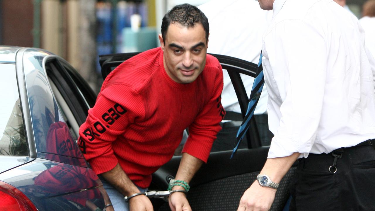 A handcuffed Yassar Bakir at Southport Watchhouse after he handed himself in. Picture: Adam Head