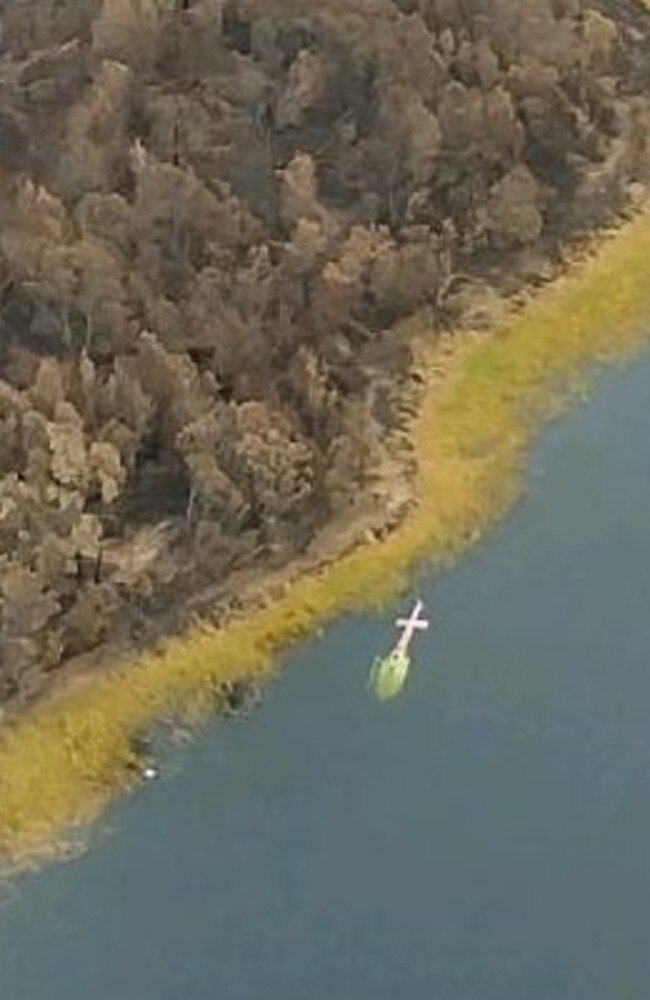 Lucy, the Pink Fleet helicopter submerged in the Ben Boyd Reservoir. Picture: Westpac Life Saver Rescue Helicopters