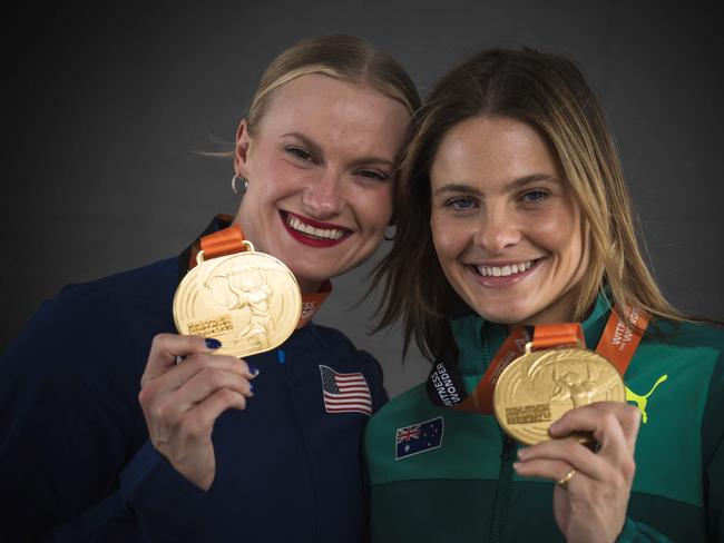 Women's pole vault joint gold medallist USA's Katie Moon (L) and Australia's Nina Kennedy  pose for portraits during a studio photo session on the sidelines of the World Athletics Championships at the National Athletics Centre in Budapest on August 24, 2023. (Photo by ANDREJ ISAKOVIC / AFP)