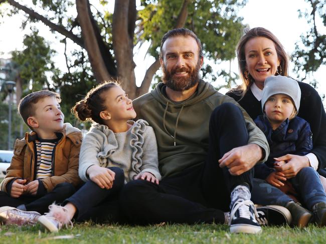 Despite giving partner Steve Willis a “no cuddling” edict, Michelle Bridges supports his decision to take part in the new series of Survivor. The couple with their son Axel, 2, and Willis’s children Jack, 7, and Ella, 10. Picture: Sam Ruttyn