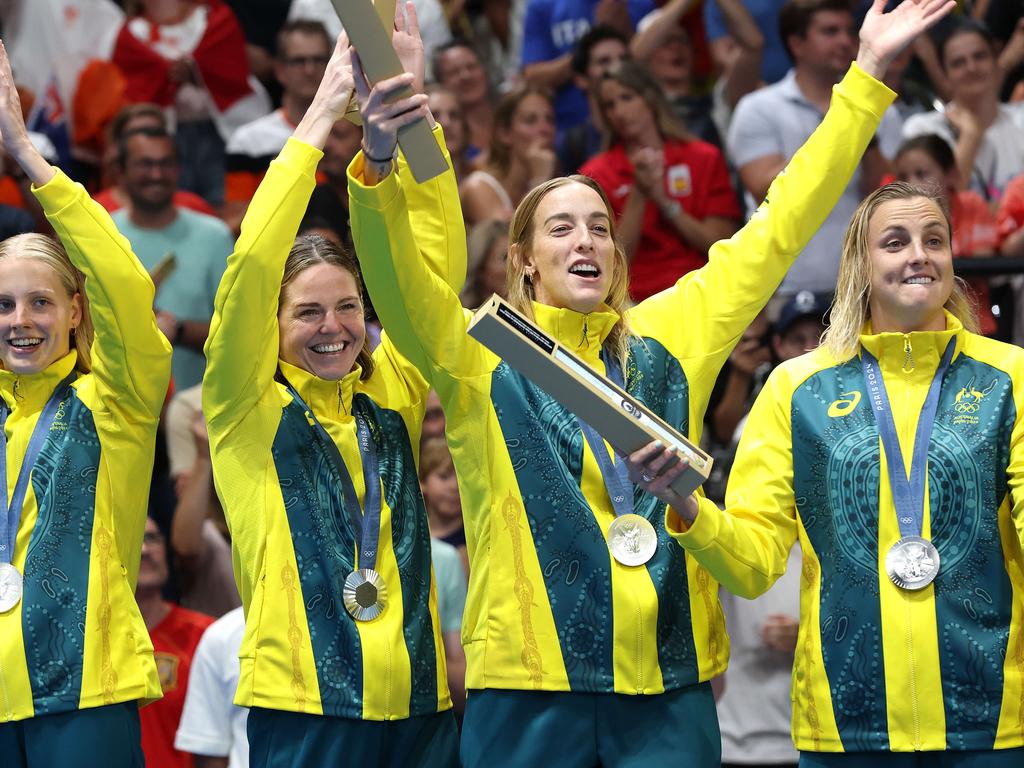 Australia celebrate after winning silver in the the water polo. Picture: Adam Head