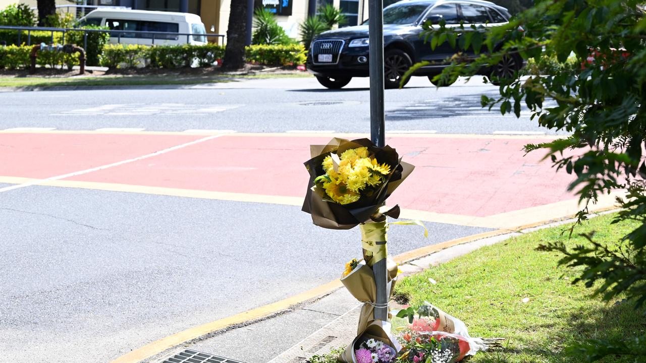 Flowers left at the scene of a fatal stabbing, across the road from a Goodlife Gym carpark in Mansfield, on Brisbane’s Southside. Picture: NCA NewsWire / Dan Peled