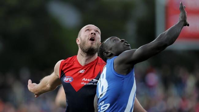 Melbourne's Max Gawn and North Melbourne's Majak Daw. Picture: Luke Bowden