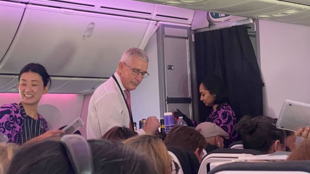 Greg Foran, Air New Zealand CEO serves drinks on a flight after it was diverted to pick up high-profile delegates who were stranded after the prime minister’s plane broke down. Picture: NZ Herald