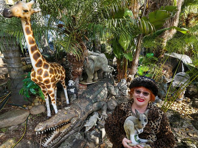 Maxine Holmes says her collection of more than 100 animal statues in her front garden showcases her love for nature. Picture: Ian Currie