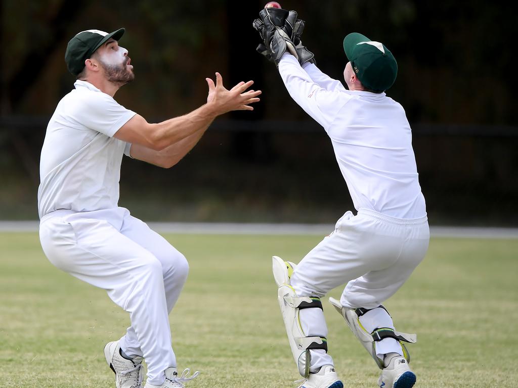 DVCA - Mine or Yours? North Eltham Wanderers pair Adam Tsapatsaris and Jake Hedley collide in the field. Picture: Andy Brownbill