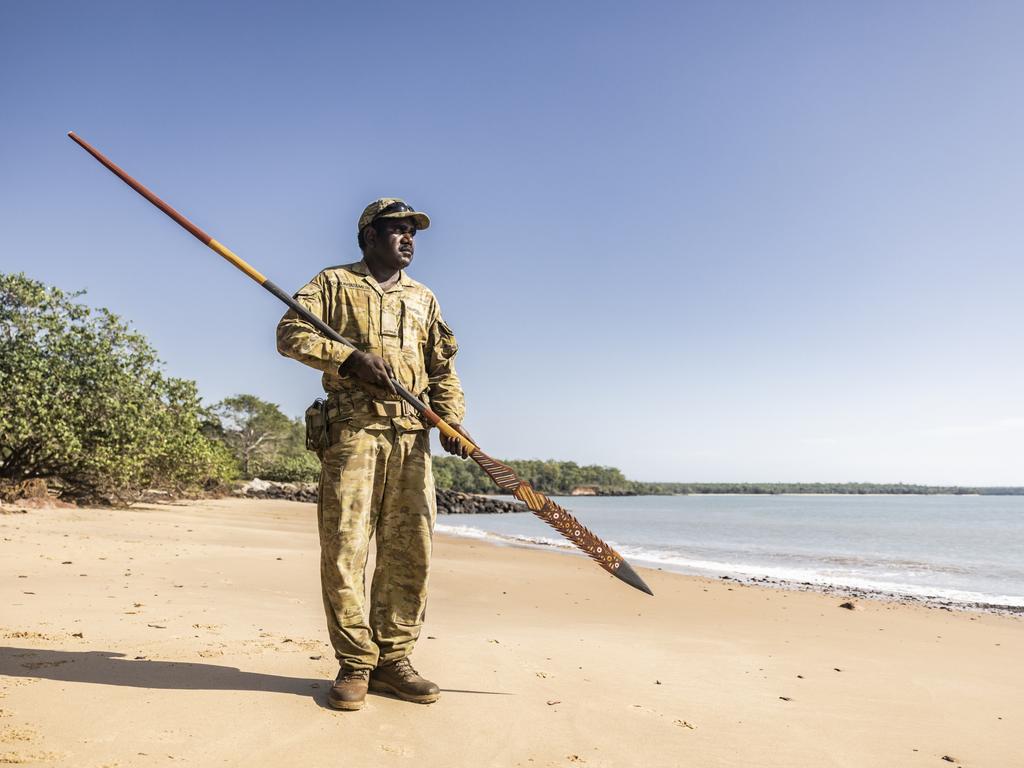 Private Peter Puruntatameri pictured holding a traditional spear on his home land of Milikapiti, Tiwi Islands. Picture: Dylan Robinson