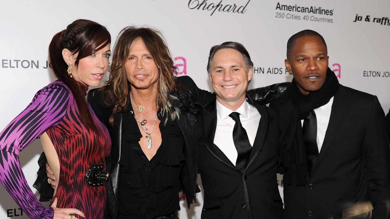 Jamie Foxx (right) turned up to Elton John’s Oscars viewing party in 2011 with his famous friends (from left to right) model Erin Brady, singer Steven Tyler and Niche Media chairman Jason Binn. Picture: Larry Busacca/Getty Images North America