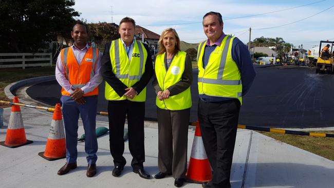 Recycled Roads: Downer's Gana Varendran, council’s director of roads transport drainage and waste Boris Bolgoff, mayor Jane Smith and deputy mayor, Chris Holstein at Long Jetty.