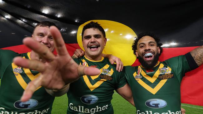 Jack Wighton, Latrell Mitchell and Josh Addo-Carr celebrate with the Aboriginal flag at the Rugby League World Cup. Photo by George Wood/Getty Images.