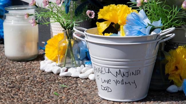 A memorial has been set up at the scene of an alleged stabbing of a 36-year-old Wadeye man outside the Cavenagh Street Woolworths supermarket on Saturday, September 16. Picture: Pema Tamang Pakhrin