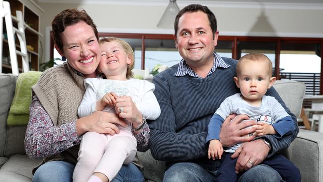 Justin and Karly Smith, with their children Mary, 2, and Flynn, 1. Picture: Jonathan Ng